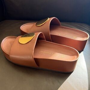 Tory Burch platform leather slides.